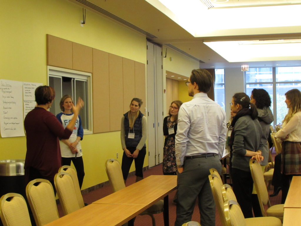 Workshop attendees in discussion with Mary O'Riordan. By Natasha Wadlington.