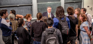 Symposium attendees in discussion with keynote speaker Rush Holt. Picture by Alina Chan.
